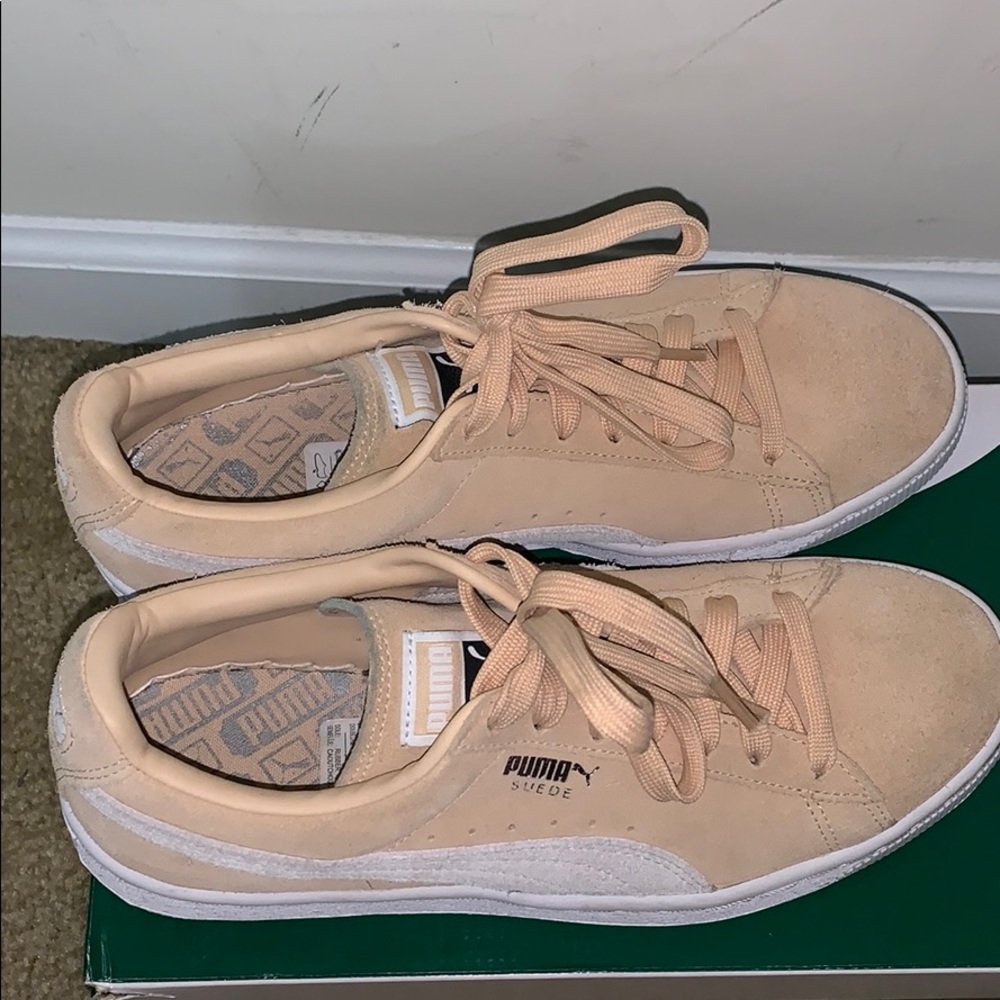 Beige and white classic pumas